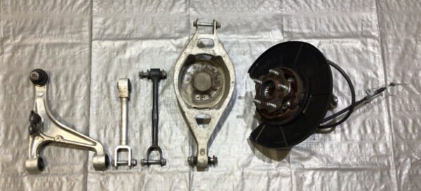 2009-2020 Nissan 370Z Driver Side Rear Knee Hub w/ Control Arms / 7Z016 - Infiniti Parts Sales