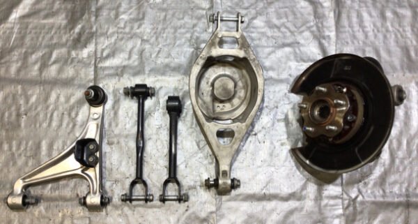2009-2020 Nissan 370Z Passenger Side Rear Knee Hub w/ Control Arms / 75K 7Z017 - Infiniti Parts Sales